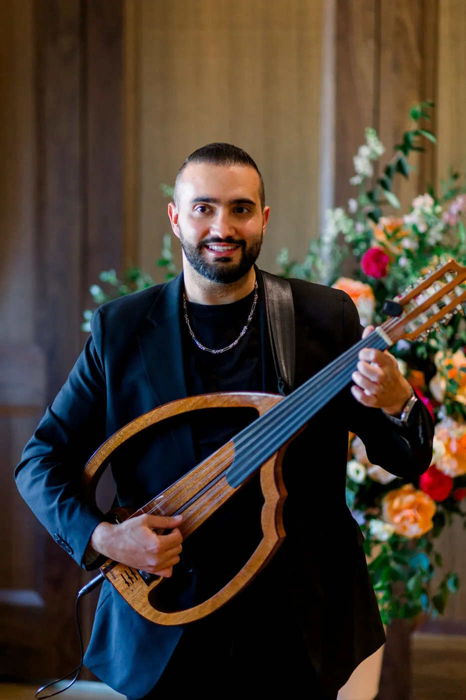 Majed performing beside the ceremony florals