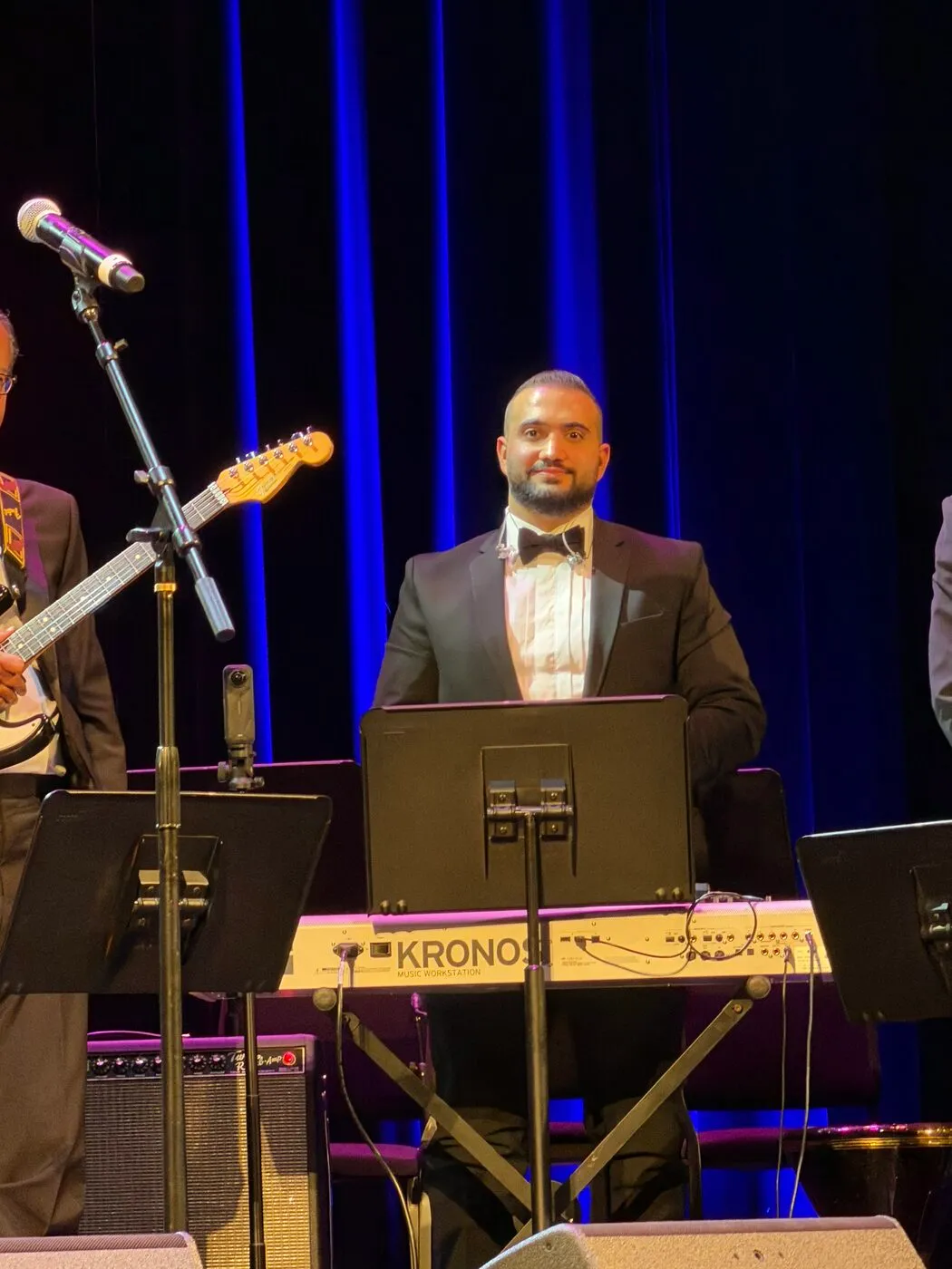 Majed on stage with the orchestra